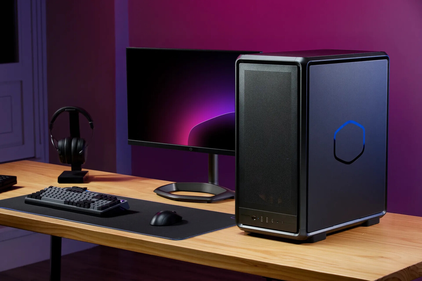 A gaming enthusiast adjusting hardware components in a transparent tower case